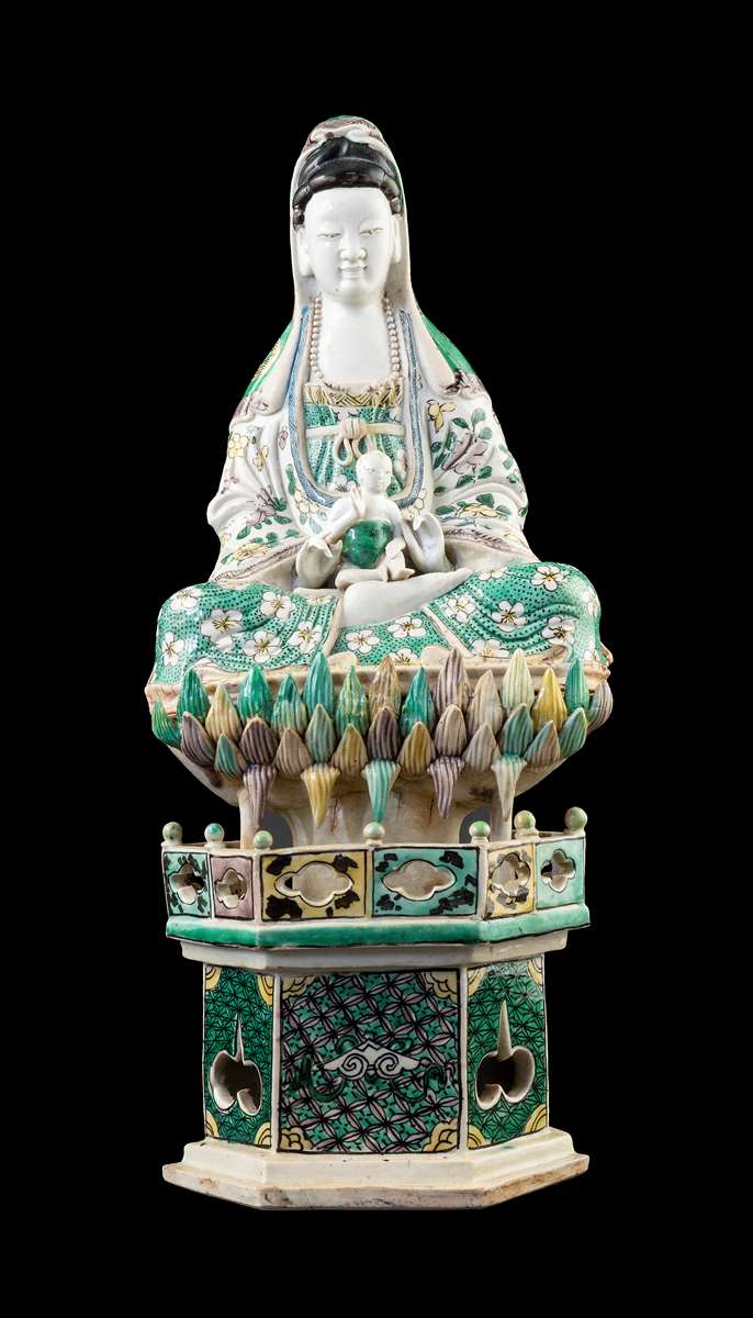 GG: Chinese porcelain famille verte biscuit figure of Guanyin seated on a lotus throne, on a stand